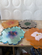 4 resin coasters with Nice design.