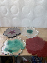 4 resin coasters with Nice design.