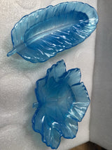 2 Trays, 1 Is a 9 inch feather, the other is a 6 inch leaf in various colors,